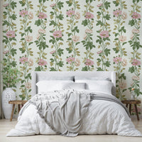 An artistic pink rose mural on minimalist wallpaper.

