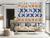 Expressive brushstroke crosses design adding movement and texture to walls.