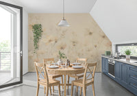 Poetic Soft Floral Honey wallpaper mural of golden wildflowers in a kitchen nook with a pine table and blue cabinets