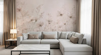 Poetic Soft Floral Petal Dust wallpaper mural of blush cosmos flowers in a living room with a grey sectional sofa