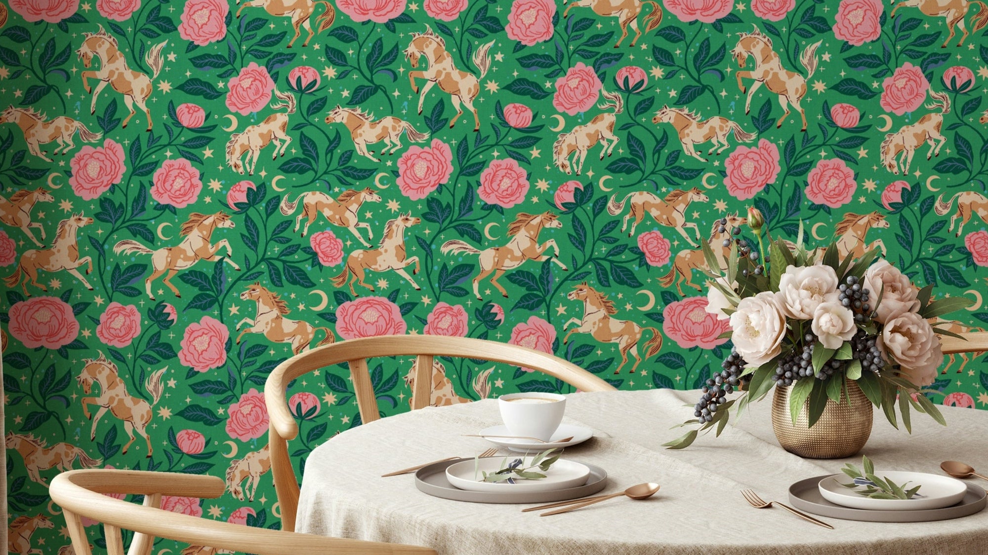 Ponies and Peonies wallpaper with tan horses and pink peonies on green behind a round dining table and chairs