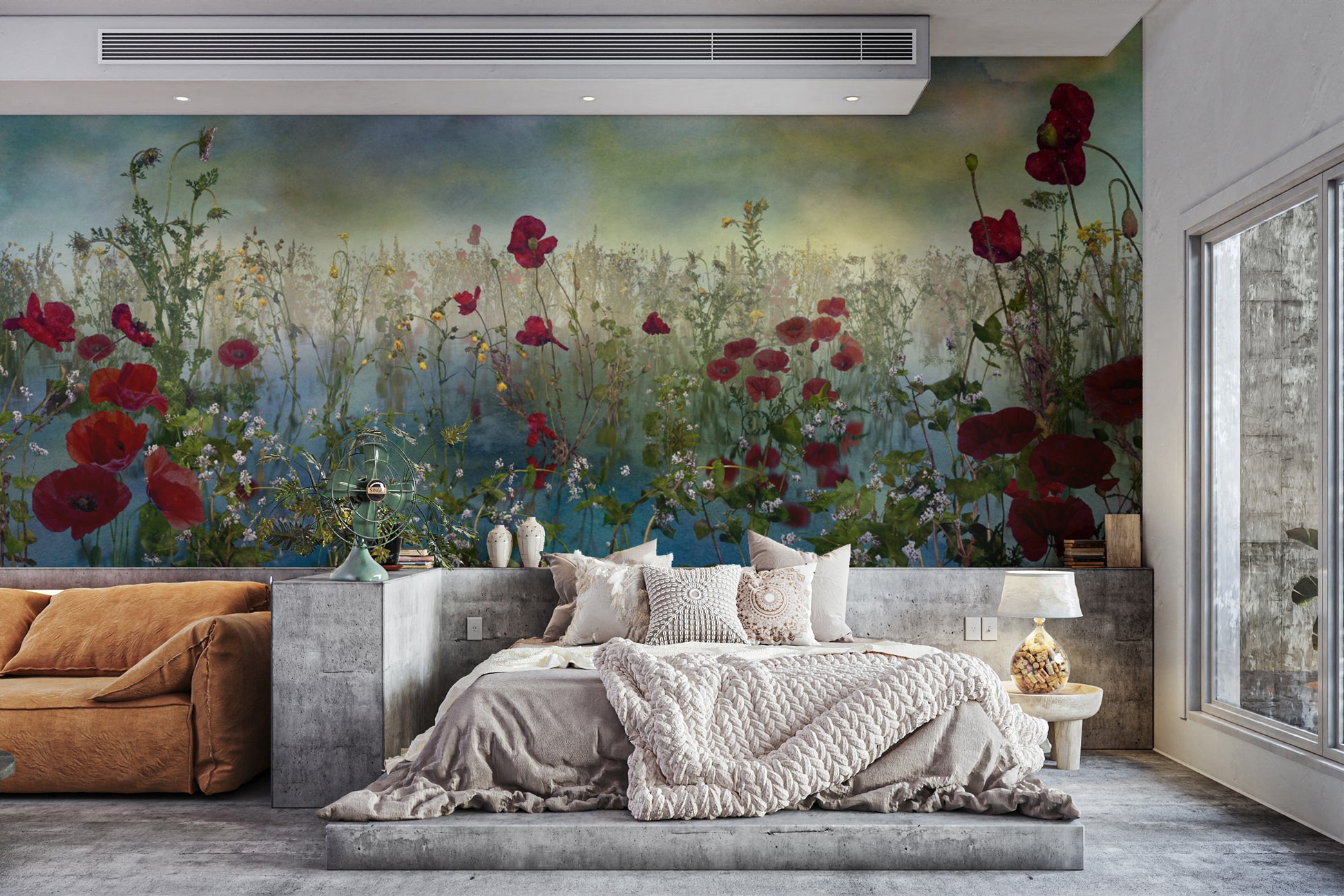 Azure Petal Panorama Poppy Blue Flower wallpaper mural of red poppies behind a concrete platform bed and tan sofa