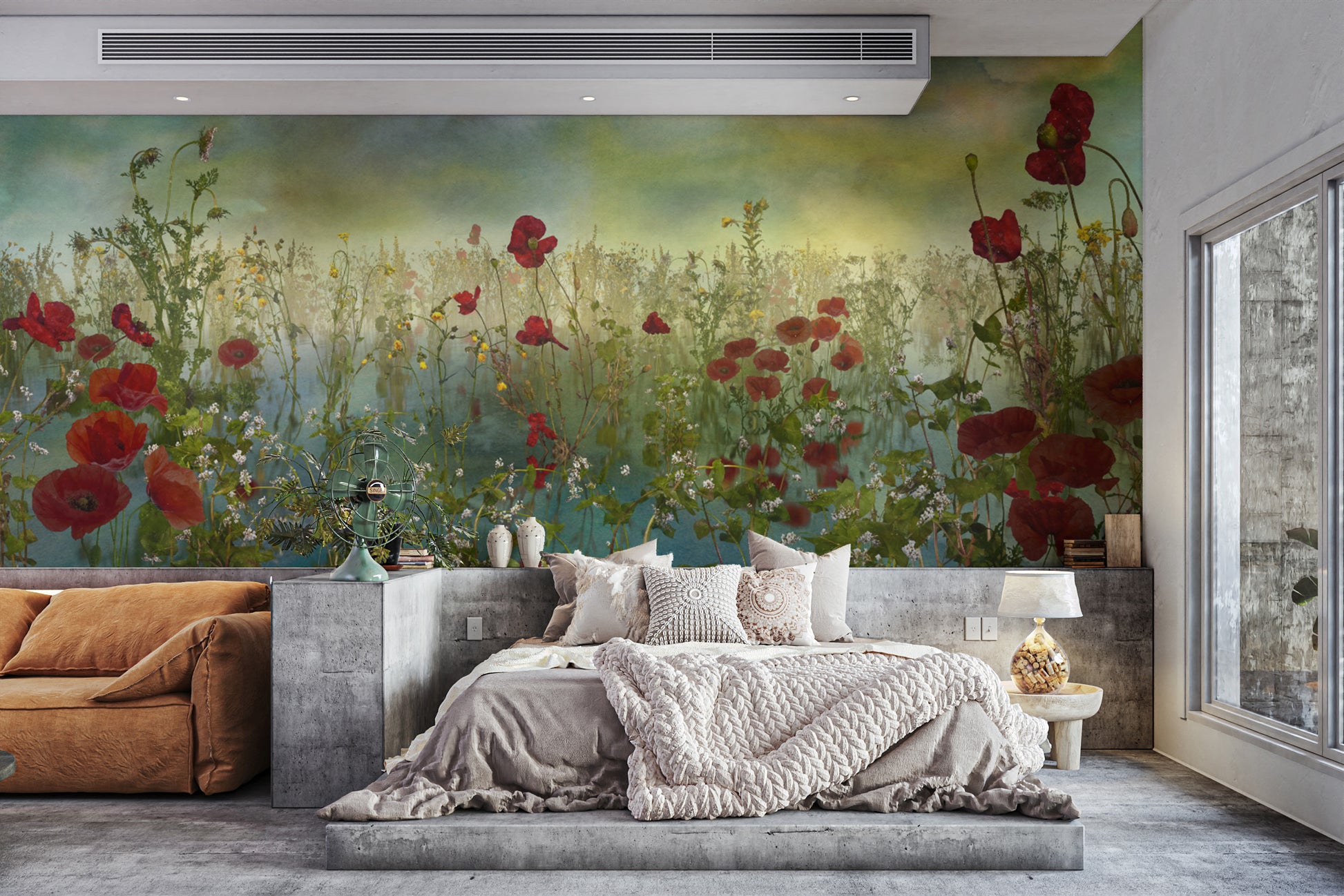 Poppy Flower Watercolor Green wallpaper mural with red poppies above a concrete platform bed and rust sofa