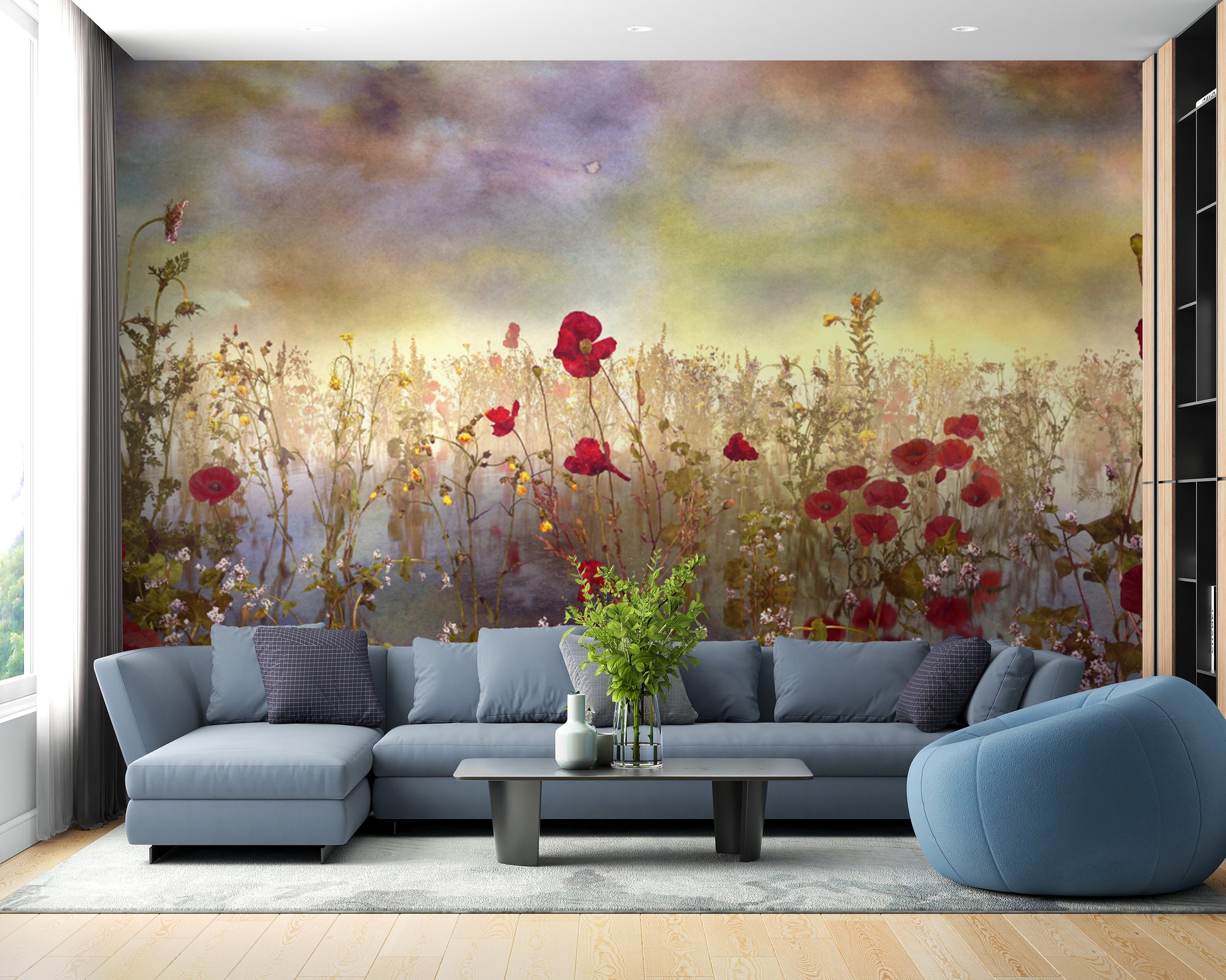 Poppy Red Color Flower wallpaper mural of a watercolor poppy meadow behind a blue-grey sectional sofa