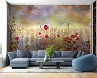 Poppy Red Color Flower wallpaper mural of a watercolor poppy meadow behind a blue-grey sectional sofa