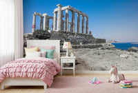 This wallpaper offers a panoramic view of the Poseidon Temple framed by clear blue skies and distant islands.