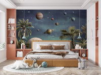 Pretty Planets wallpaper mural with Saturn and planets over palms behind a mustard bed in a kids bedroom