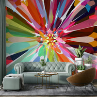 Artistic burst mural in rainbow-toned geometry

