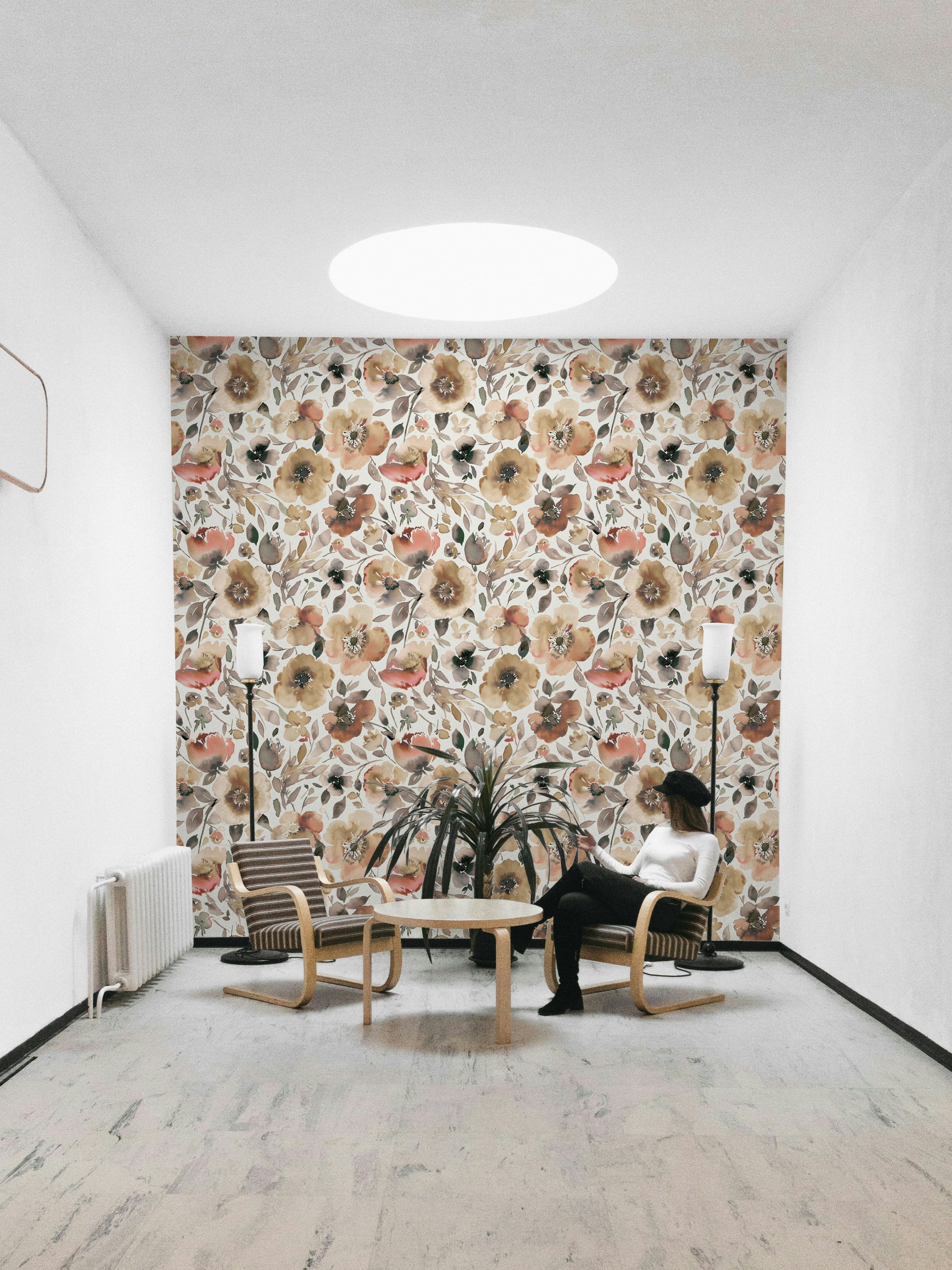 Retro floral mural with large poppies in orange, coral, and yellow.

