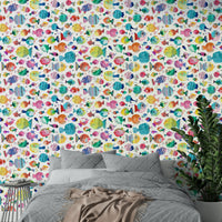 Wallpaper with sea bubbles, coral, and smiling puffer fish.

