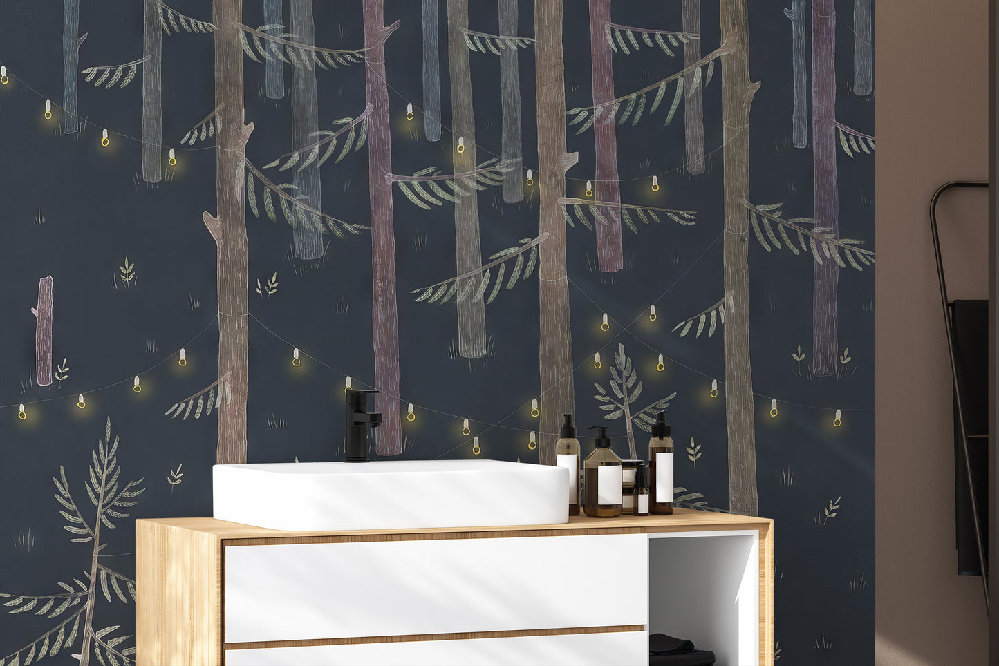 Midnight Grove Fairy Lights wallpaper mural of a dark forest behind a white vessel sink and wood vanity in a bathroom