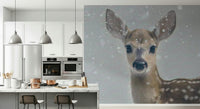 Nature-inspired wallpaper with a delicate fawn in a serene winter forest.