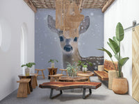 Wall mural depicting a calm fawn in soft snowy surroundings for cozy interiors.