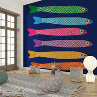 Colorful underwater scene with rainbow anchovies on a bold royal blue mural.

