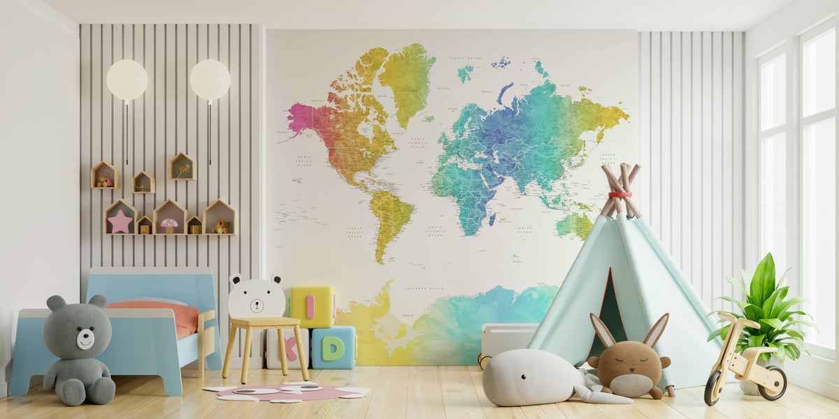Rainbow World Map wallpaper in rainbow watercolor behind a blue toddler bed, teddy bears and a mint teepee in a kids room