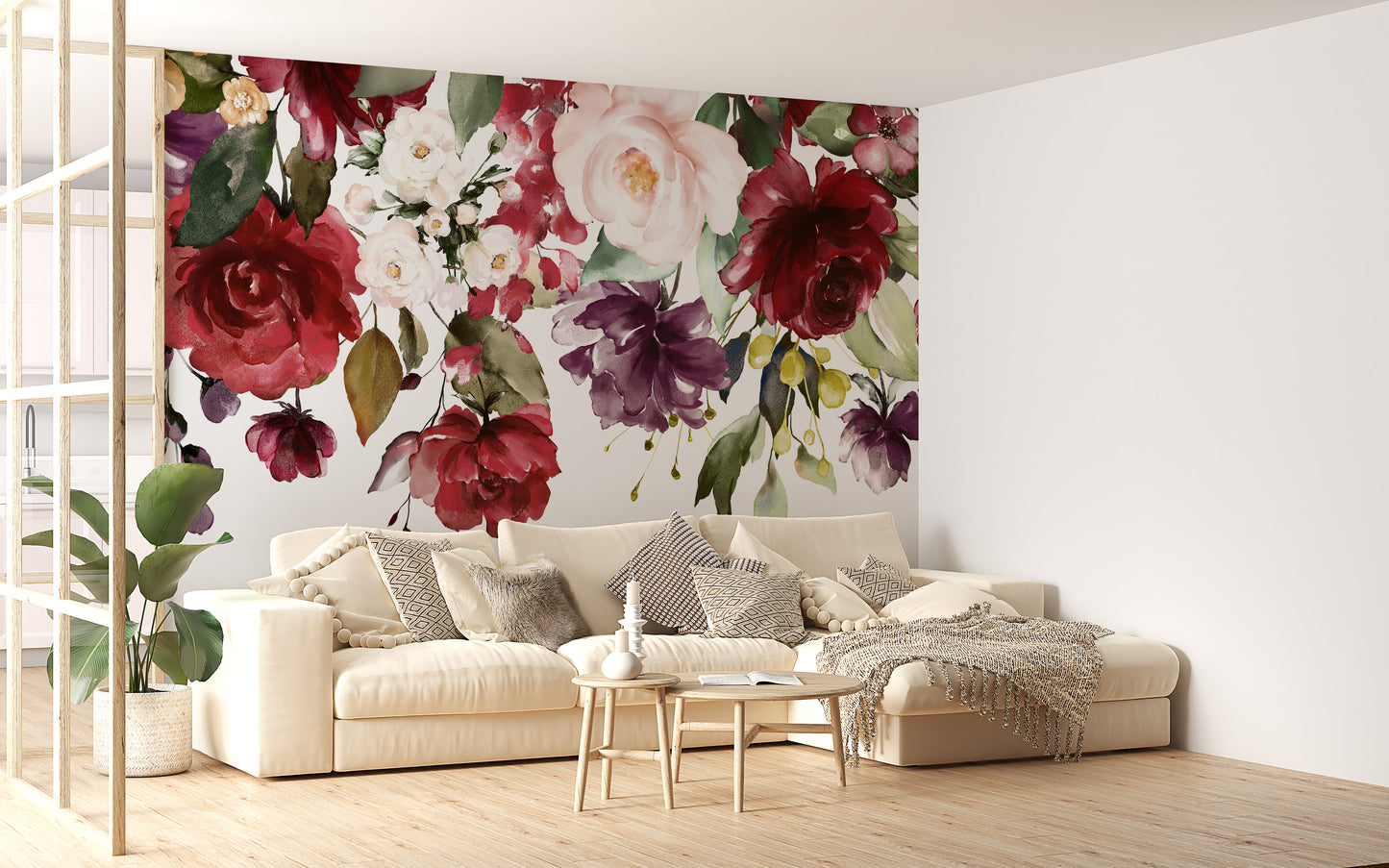 Red and Pink Floral wallpaper mural of dense roses behind a cream sectional sofa in a living room