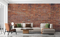 Vintage red brick wallpaper mural with white scuffs.