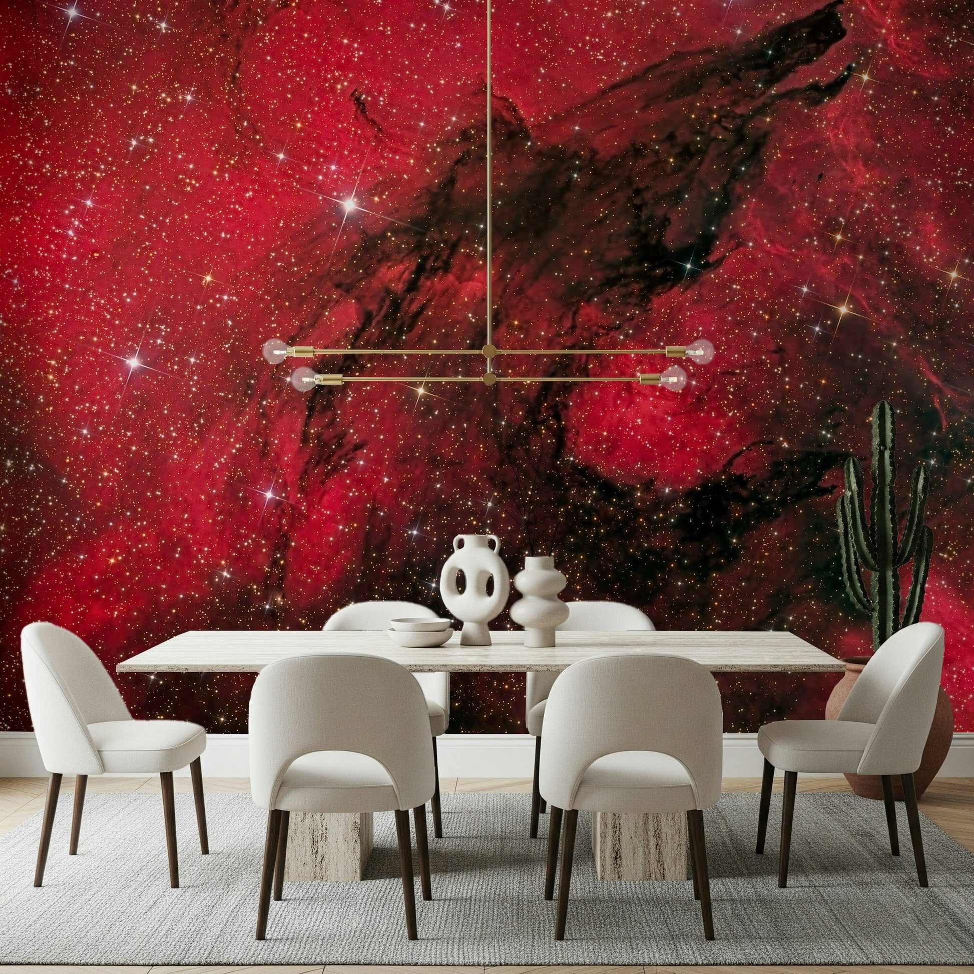 Cosmic Ember wallpaper mural in red starry nebula behind a white dining table and chairs with gold chandelier