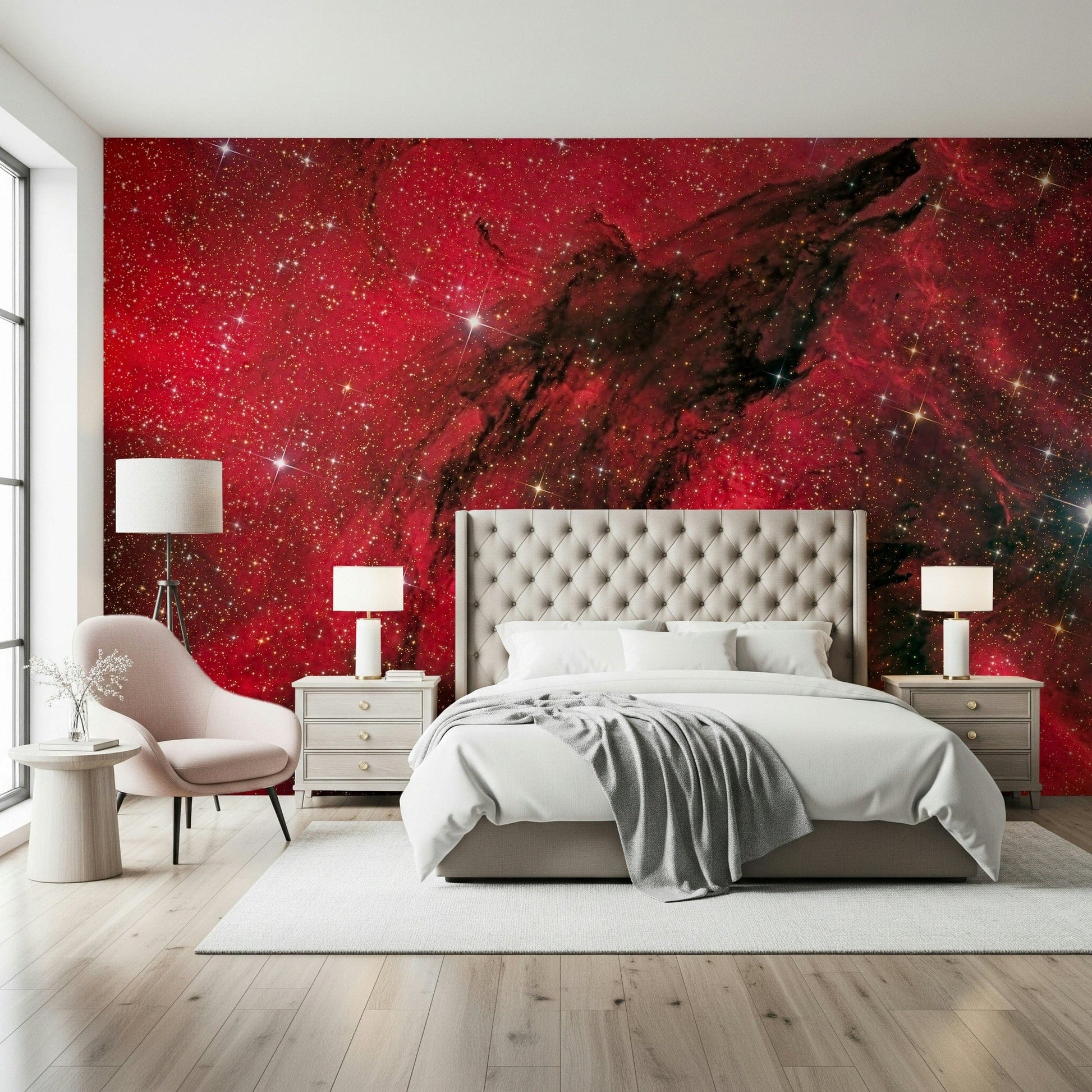 Cosmic Ember wallpaper mural of red starfield behind a tufted headboard with pink chair in a bedroom