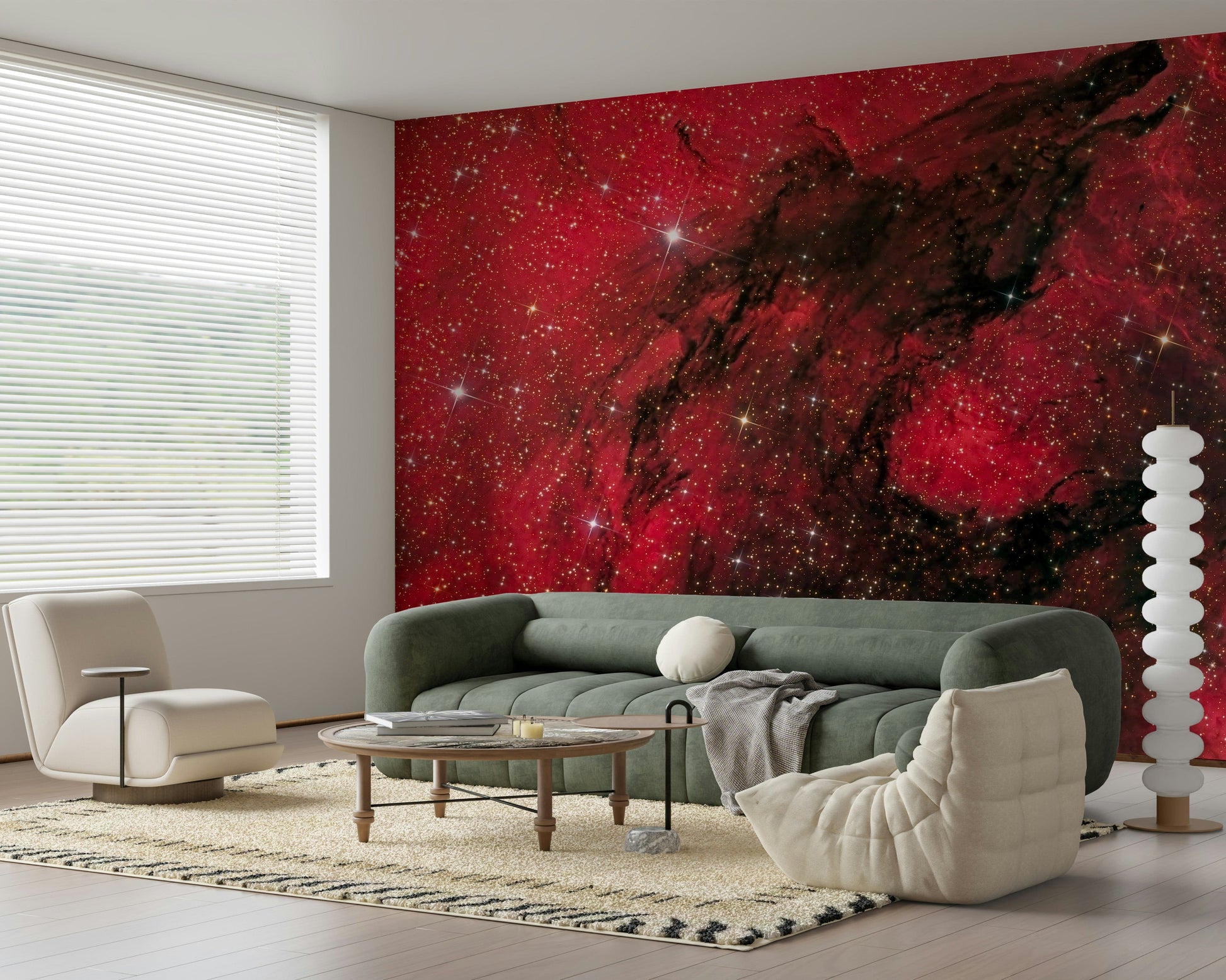 Cosmic Ember wallpaper mural with red nebula and black dust lanes above a green sofa in a modern living room