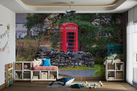 A bedroom with the London mural behind the headboard.


