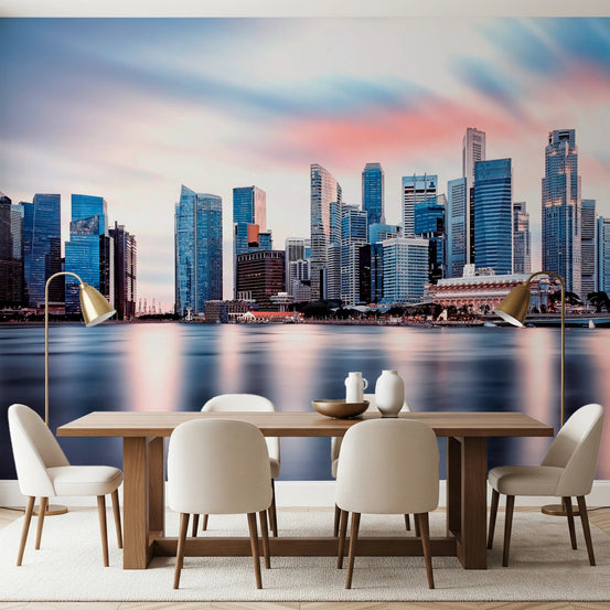 Reflective Metropolis wall mural of a city skyline at dusk behind a wood dining table and cream chairs