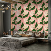 The background is a distinctive avocado pink.
