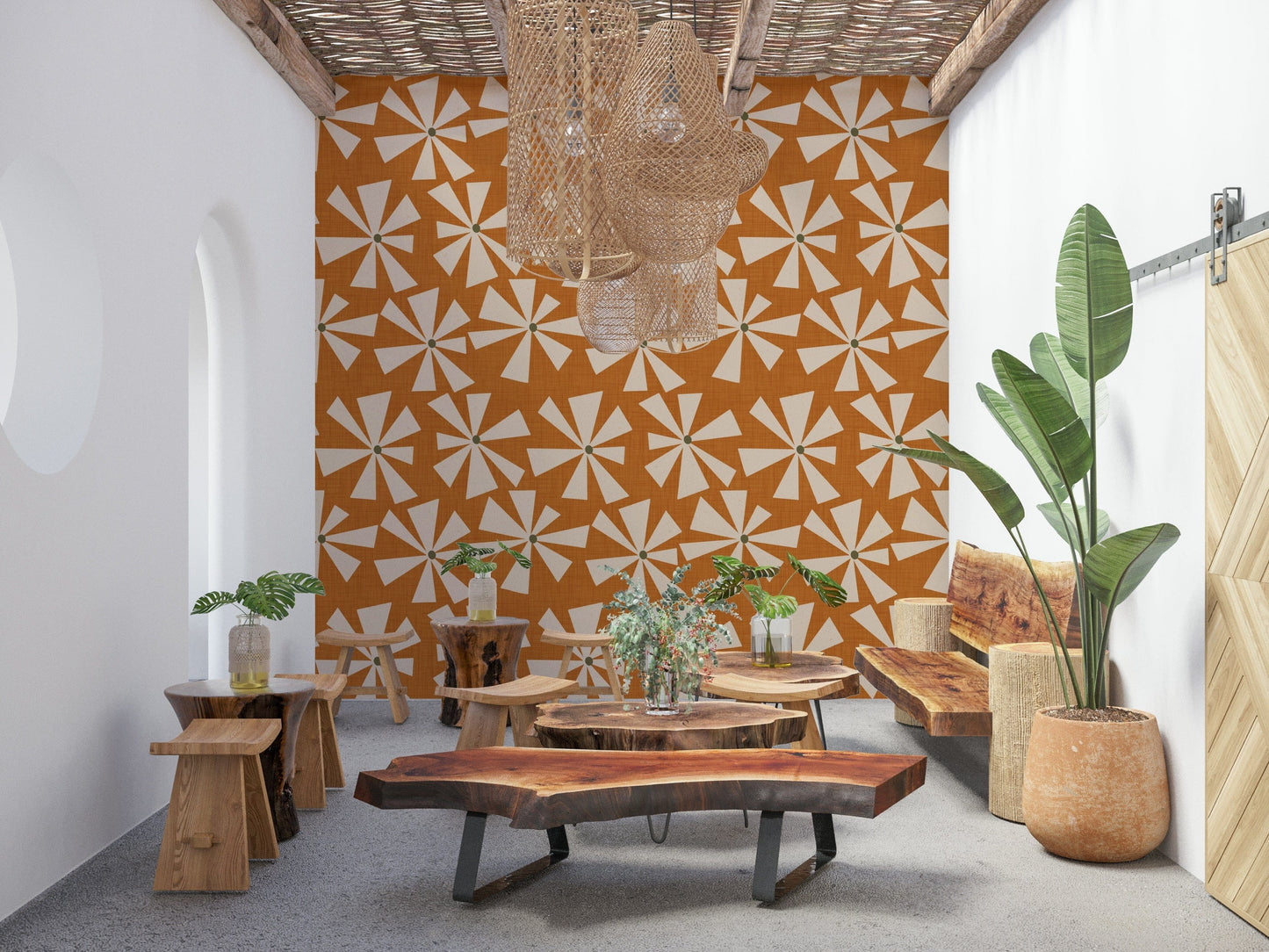 Decorative mid-century wallpaper featuring cream starburst blooms on a textured orange surface.