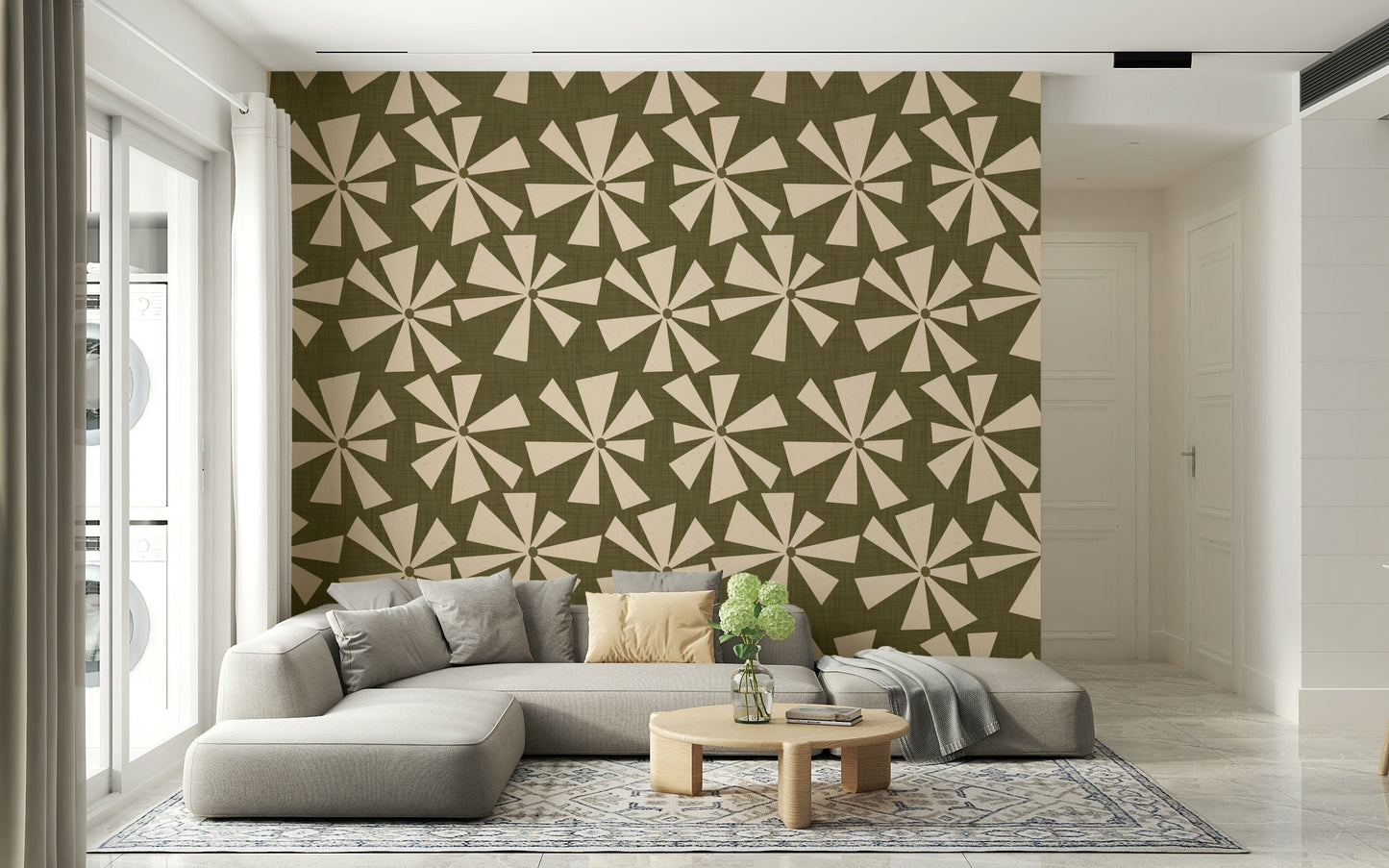 Abstract geometric wallpaper with cream pinwheel motifs on a vintage olive background.