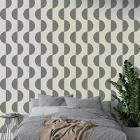 The wallpaper is applied seamlessly, giving the wall a uniform look.

