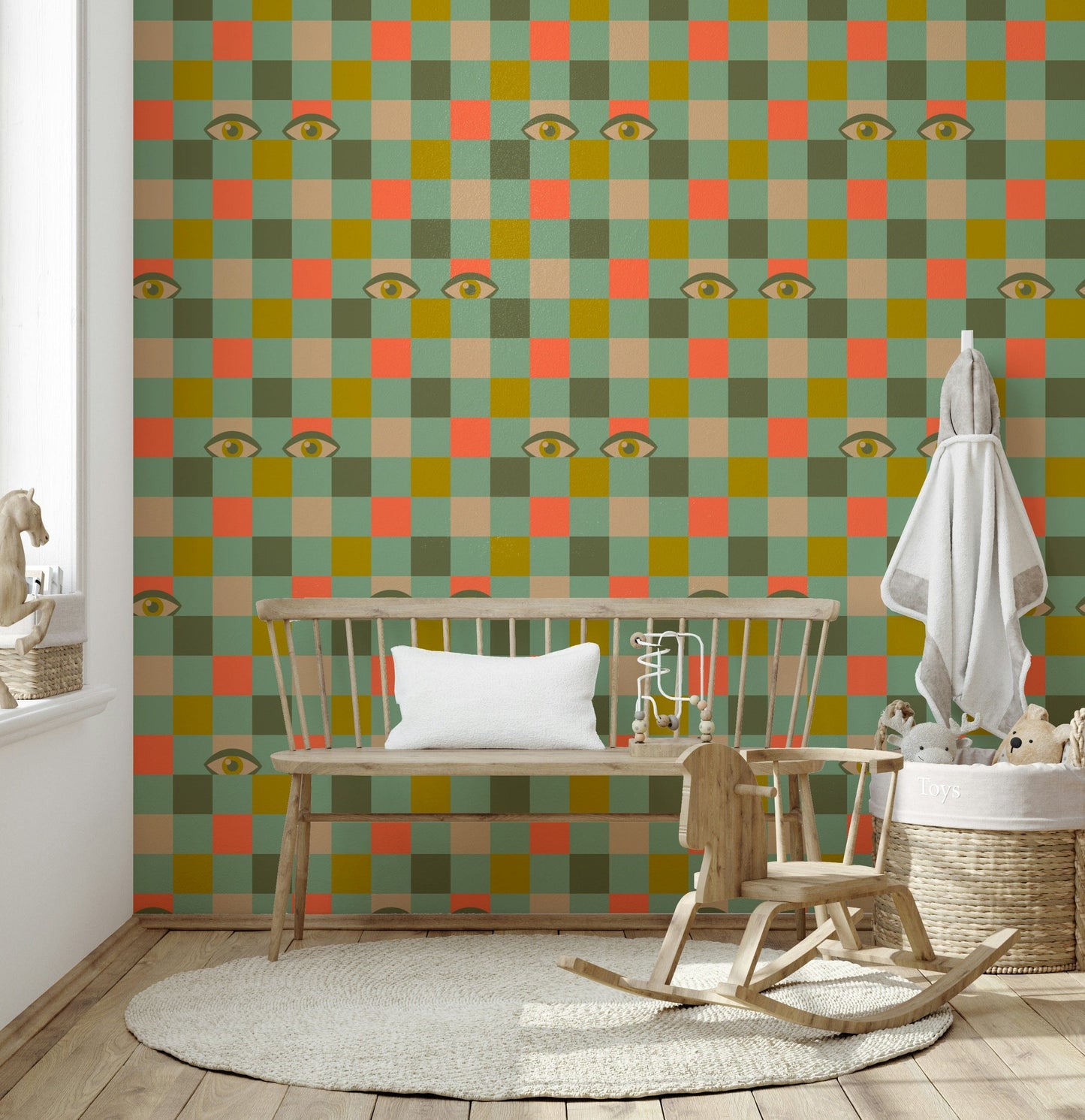 A vibrant checkerboard wallpaper decorated with stylized eyes placed across mustard, coral, cream, olive, and mint tiles.