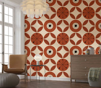 Bold floral wallpaper featuring abstract mid-century flowers and leaf clusters in earthy hues.