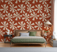 Retro burst wallpaper featuring geometric star-like flowers in an earthy orange palette.