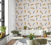 Beachy wallpaper with a scattered pattern of surfboards and nostalgic coastal road-trip cars.