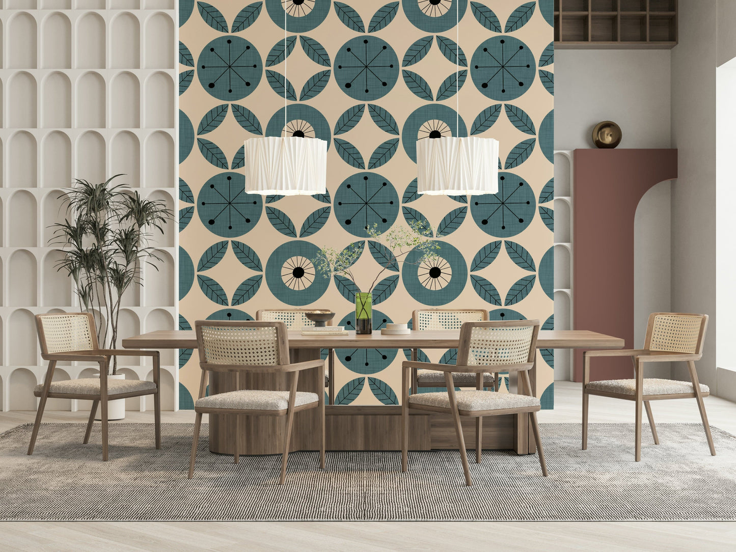 A teal geometric wallpaper with radial circles and symmetrical leaf shapes arranged in rows.