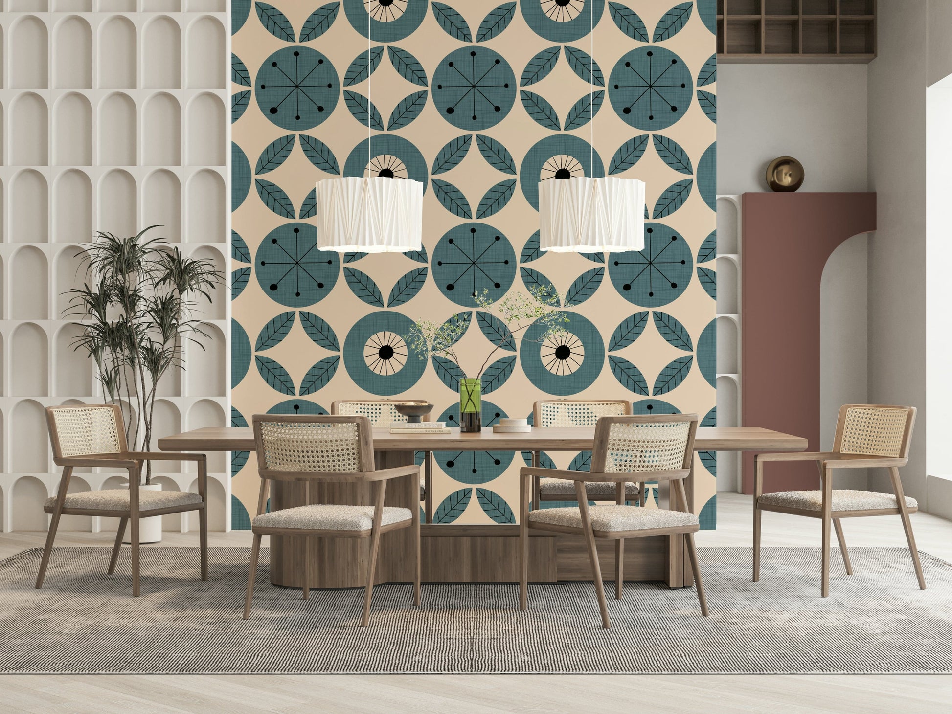 A teal geometric wallpaper with radial circles and symmetrical leaf shapes arranged in rows.
