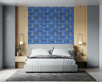 Blue and gold water rhythms wallpaper with repeating abstract organic shapes.
