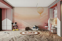 Romantic rose-toned sky mural used in a primary suite for a serene look.