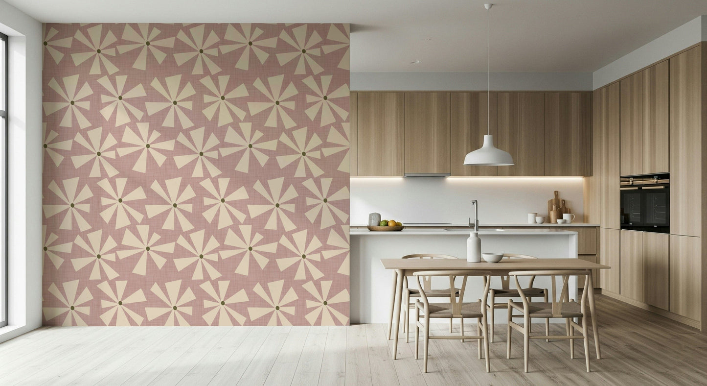 Chic mid-century wallpaper with playful cream flower bursts on a dusty rose surface.