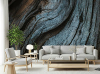 Rustic wood wallpaper mural in faded blue hues creating a warm, textured, and inviting feature wall.