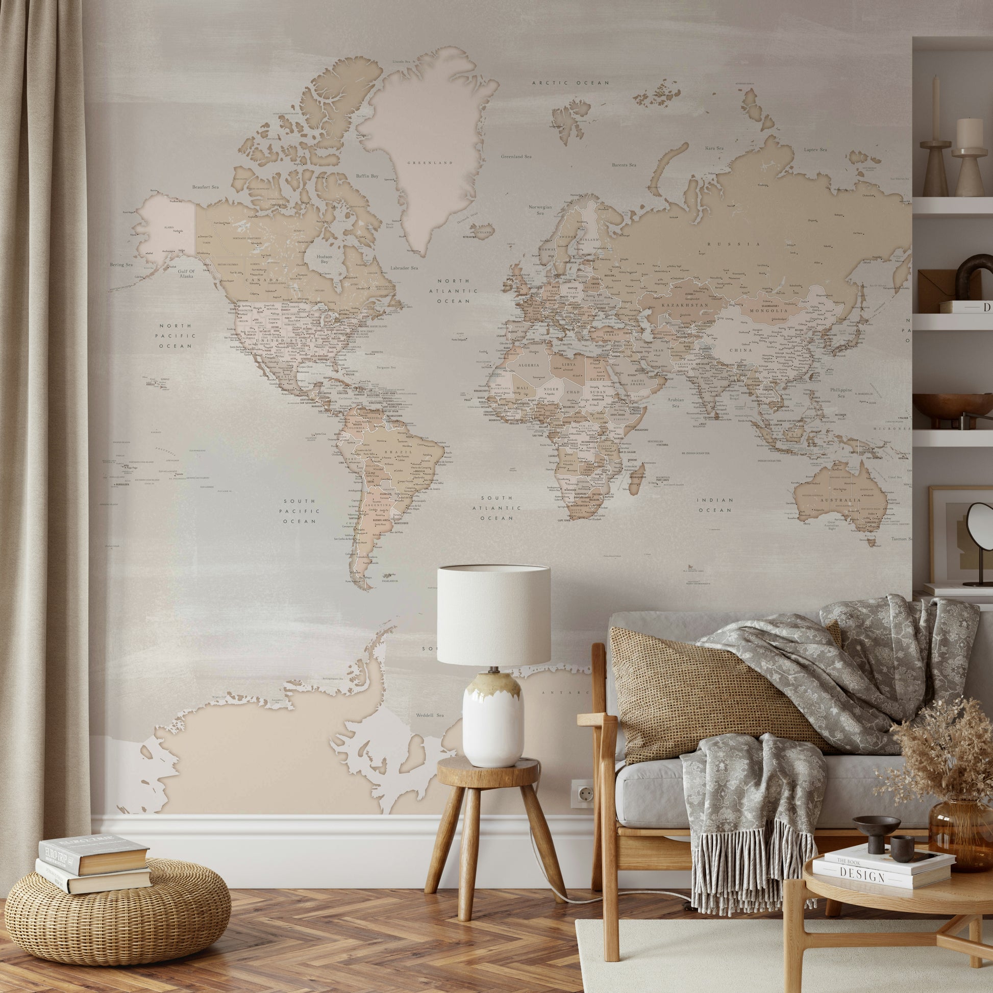 Rustic World Map wallpaper in beige behind a wood-frame sofa with mustard cushion and a lamp on a stool in a living room