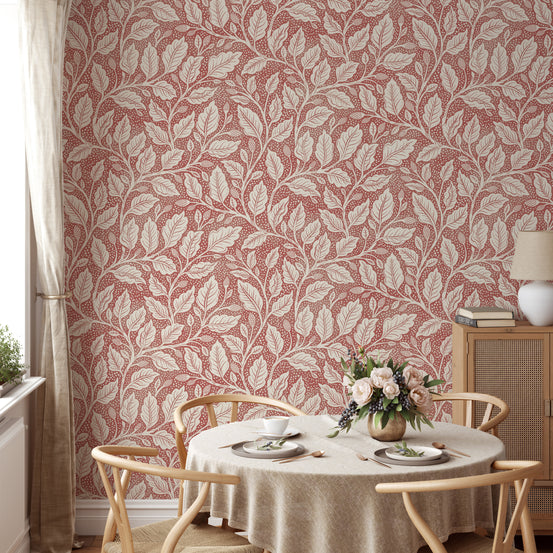 Rustic Red Budding Branches wallpaper with cream leaves on dusty red in a dining room with wishbone chairs and roses