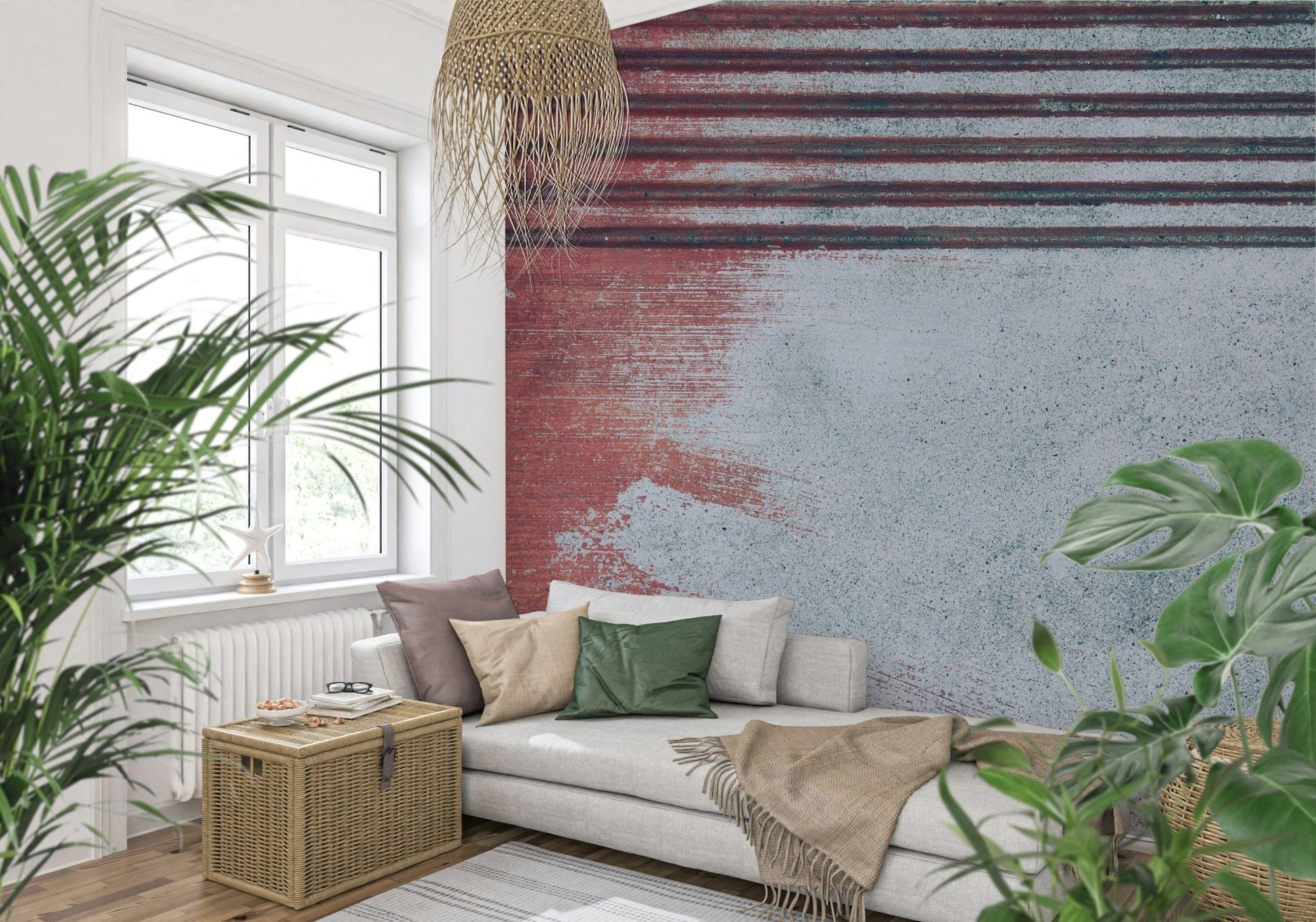 Rustic Rouge Concrete wallpaper mural in red and gray behind a white sofa and woven pendant among plants
