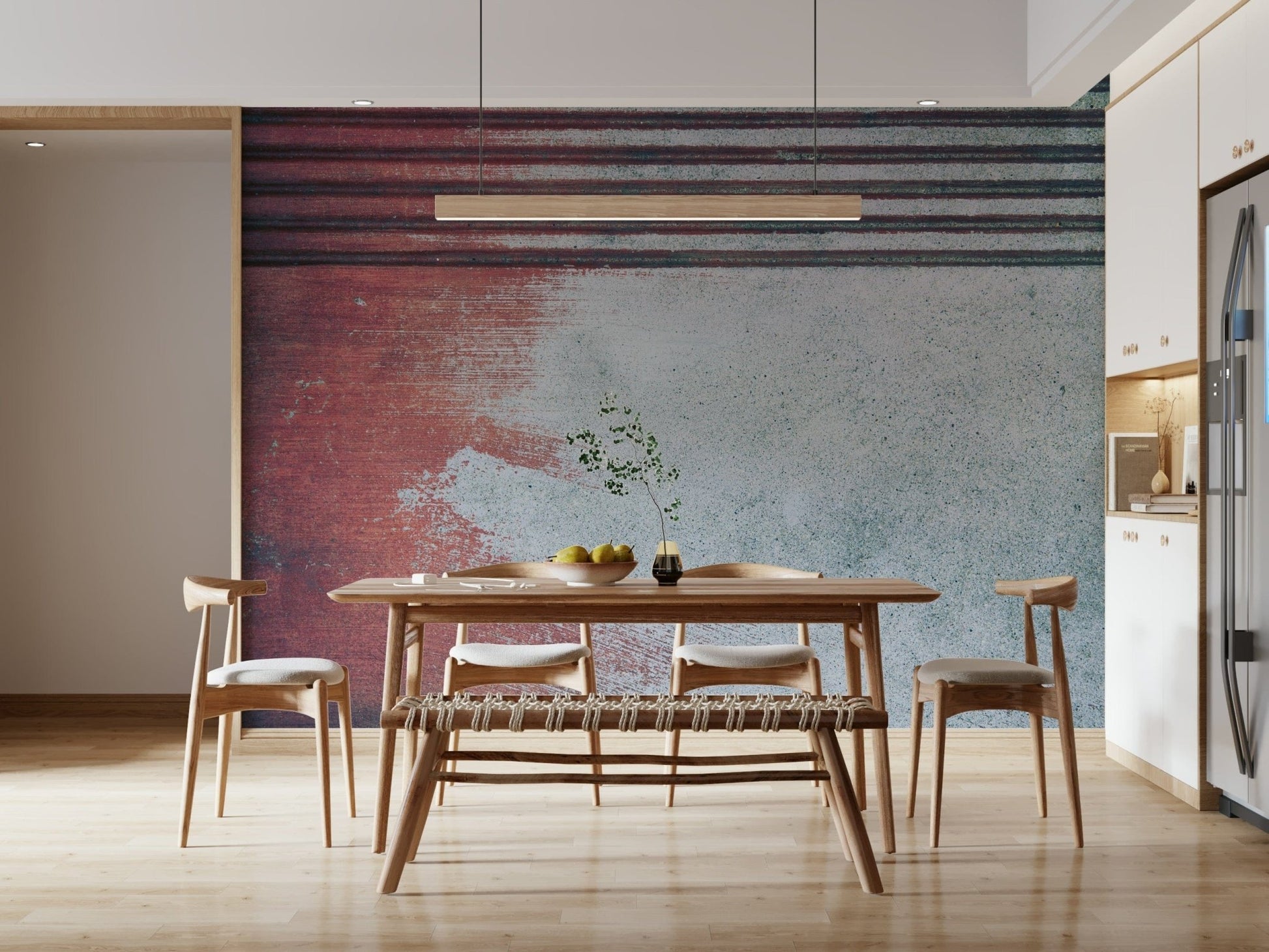 Rustic Rouge Concrete wallpaper mural in red fading to gray behind a wood dining table and bench in a kitchen