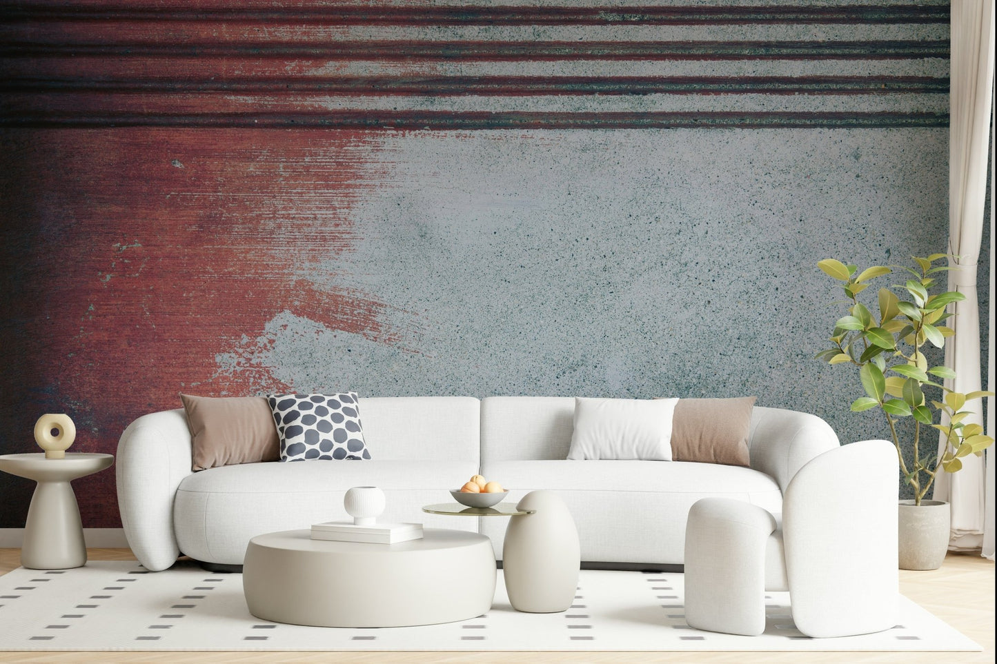 Rustic Rouge Concrete wallpaper mural in red and gray behind a white curved sofa with a polka-dot pillow
