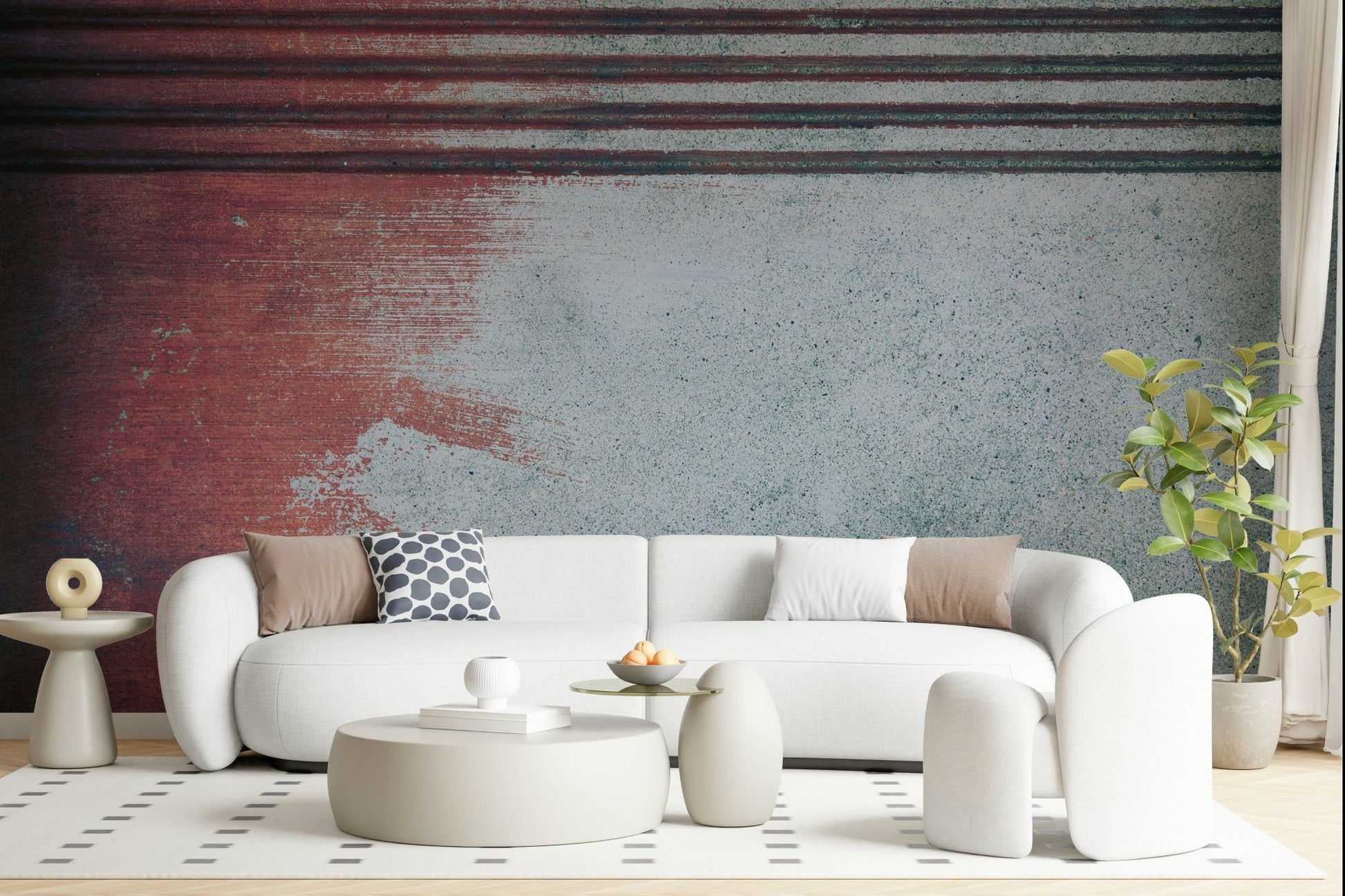 Rustic Rouge Concrete wallpaper mural in red and gray behind a white curved sofa with a polka-dot pillow