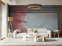 Rustic Rouge Concrete wallpaper mural in red and gray behind a cream sofa and wood ring chandelier
