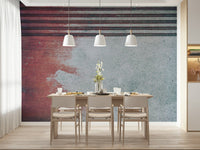 Rustic Rouge Concrete wallpaper mural in deep red fading to gray behind a wood dining table and white pendants