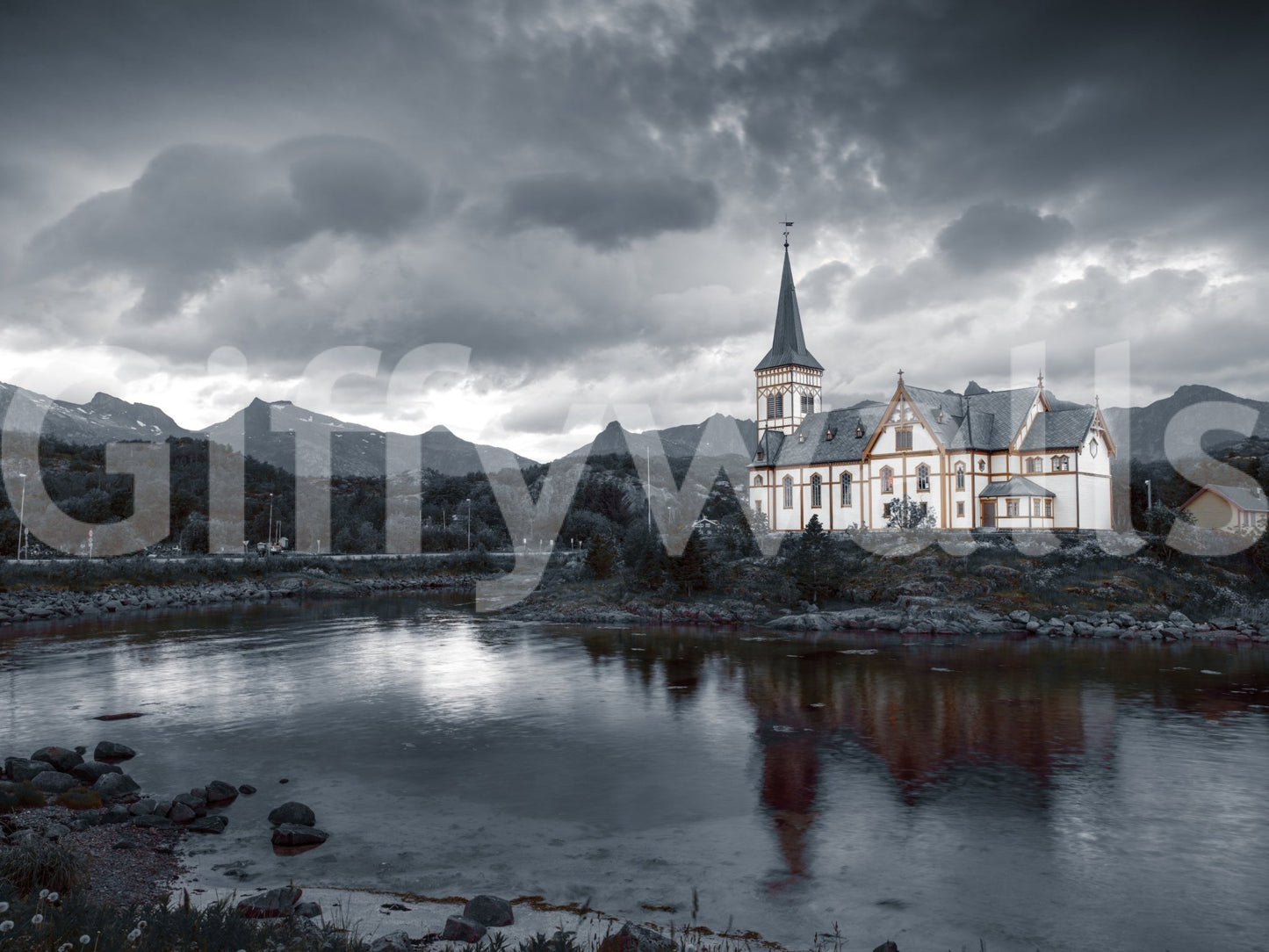Sacred Shores wallpaper mural shown as a full-wall mural of a white steepled church by a lake under a stormy grey sky
