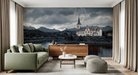 Sacred Shores wallpaper mural of a church and grey mountains behind a sage green sofa and wood sideboard in a living room